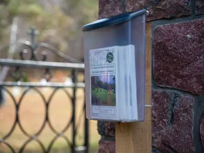 Walking tour brochure in a pick up box located near the westernmost gate