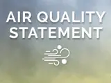 A graphic overlayed on top of a photo of smoke with text that says "Special Air Quality Statement"