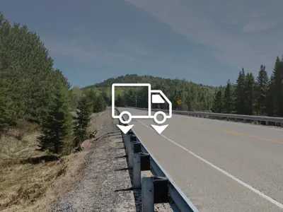 Image depicting a road in Lake of Bays with a truck icon featuring downward-pointing arrows next to the wheels, indicating weight restrictions.