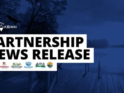 a boat dock with a sign that says partners news release