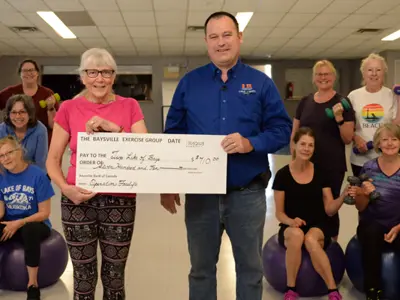 The Baysville Exercise Group presenting a cheque to the Superintendent of Parks and Facilities for the Township of Lake of Bays