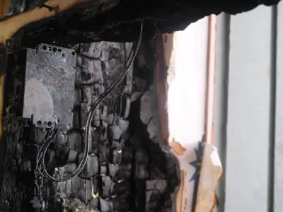 Electrical malfunction involving a wall outlet has been identified as the cause of the fire.