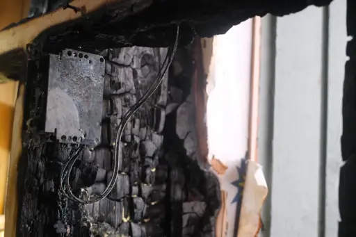 Electrical malfunction involving a wall outlet has been identified as the cause of the fire.